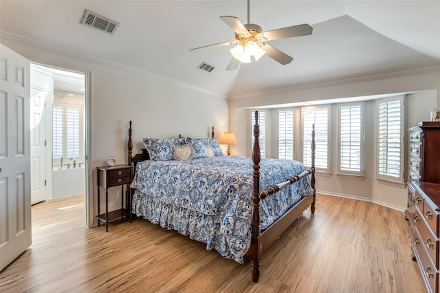 bedroom with multiple windows, visible vents, light wood finished floors, and ornamental molding