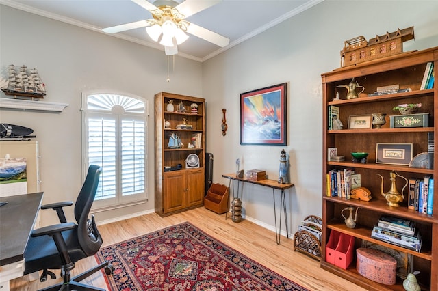 home office with baseboards, light wood finished floors, ceiling fan, and ornamental molding