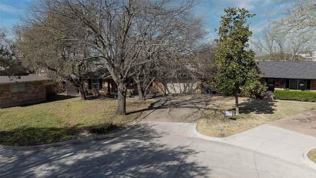 109 Belden Cir, Mckinney, TX 75069 - view of property hidden behind natural elements with a garage, driveway, and a front yard