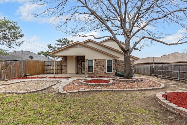 back of property featuring a patio area, a fenced backyard, and brick siding