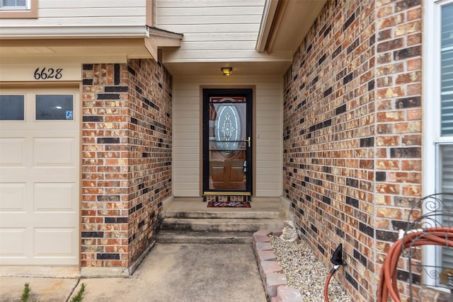 entrance to property with brick siding