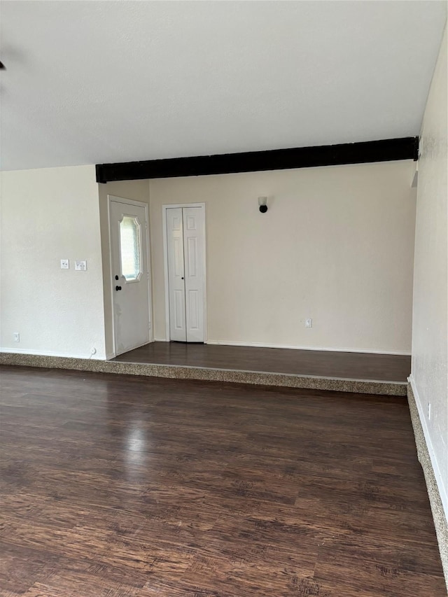 entryway with dark wood-type flooring and baseboards