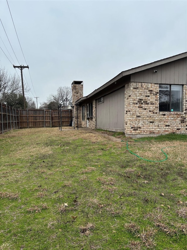 view of yard with fence