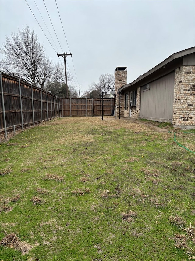 view of yard featuring fence