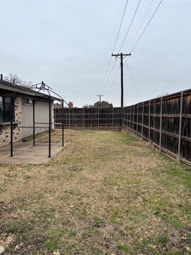 view of yard featuring a patio and a fenced backyard