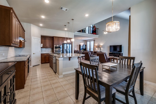 dining room featuring visible vents, high vaulted ceiling, light tile patterned flooring, recessed lighting, and a notable chandelier