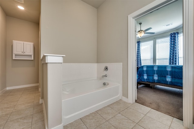 bathroom featuring tile patterned floors, visible vents, a garden tub, ensuite bath, and baseboards