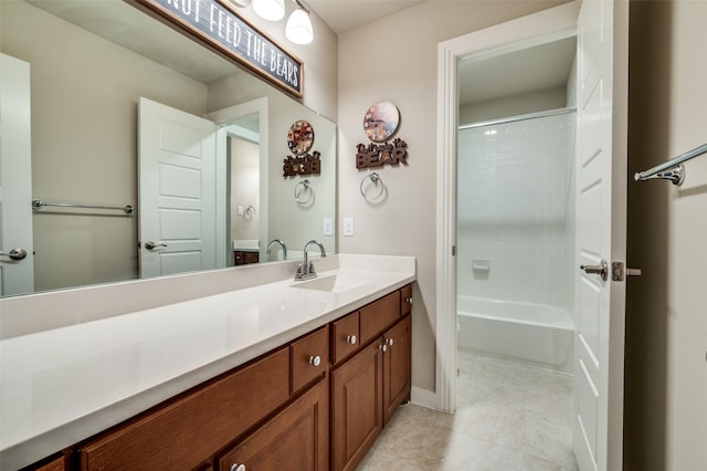 bathroom with tile patterned flooring, vanity, shower / bathing tub combination, and baseboards