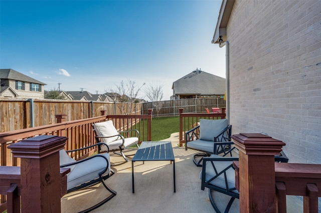 view of patio / terrace featuring an outdoor living space and a fenced backyard