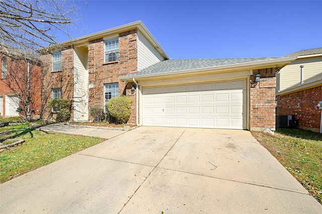 traditional home featuring brick siding, a shingled roof, concrete driveway, central AC unit, and a garage