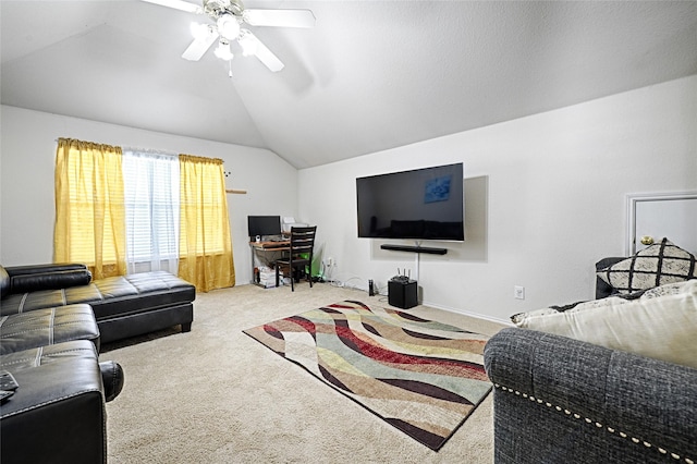 living area with lofted ceiling, ceiling fan, and carpet