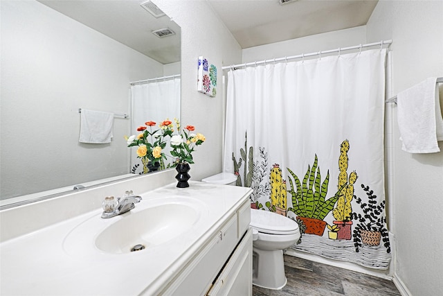 full bath featuring visible vents, vanity, wood finished floors, and toilet