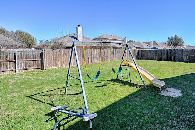 view of jungle gym featuring a fenced backyard and a yard