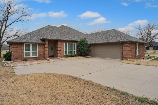 view of front of home with an attached garage, brick siding, concrete driveway, and roof with shingles