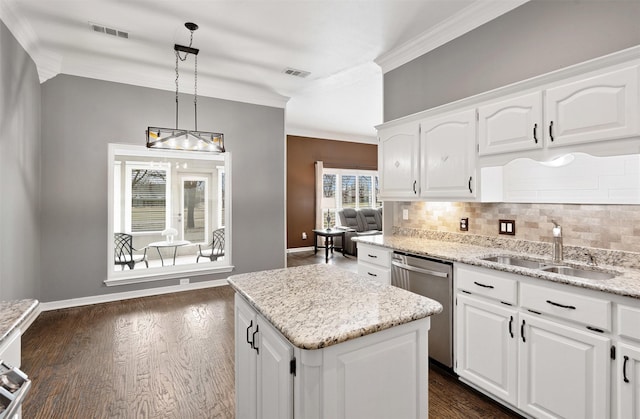 kitchen with ornamental molding, visible vents, a sink, and stainless steel dishwasher