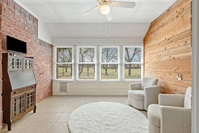 sunroom / solarium featuring a ceiling fan and vaulted ceiling