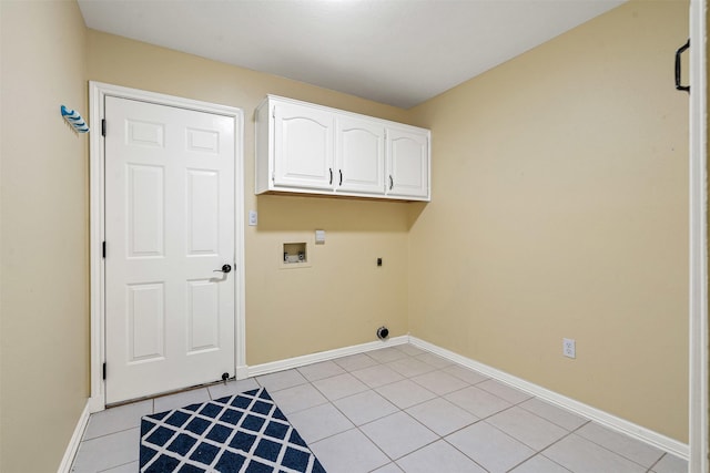 laundry room featuring light tile patterned floors, cabinet space, baseboards, washer hookup, and electric dryer hookup