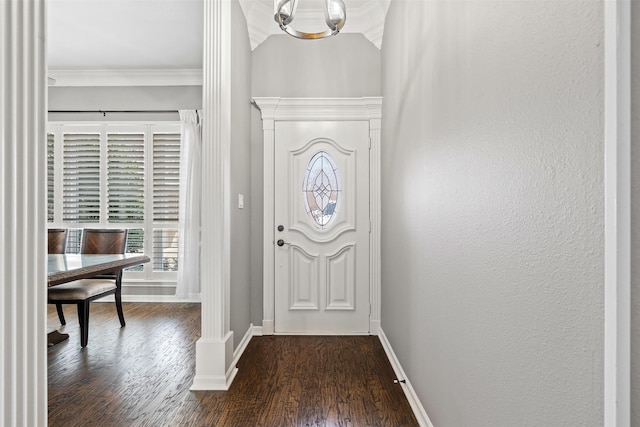 entrance foyer featuring baseboards, dark wood finished floors, and crown molding