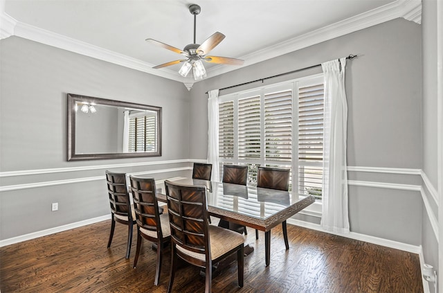 dining room featuring wood finished floors, a ceiling fan, and crown molding