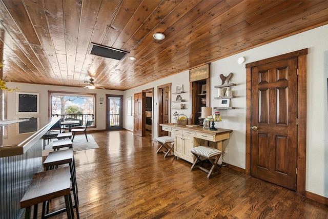 foyer featuring wood ceiling, baseboards, and dark wood-style flooring