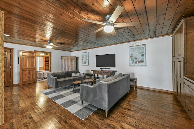 living room with dark wood-style flooring, crown molding, and baseboards