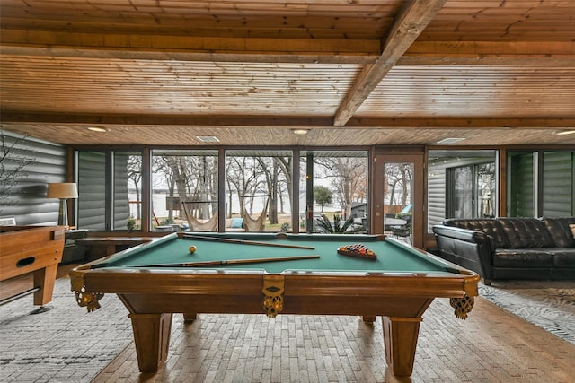 rec room featuring a wealth of natural light, beam ceiling, wooden ceiling, and rustic walls