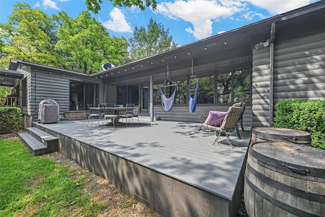 deck featuring outdoor dining space