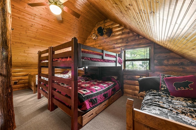 bedroom with vaulted ceiling, wood ceiling, carpet flooring, and log walls