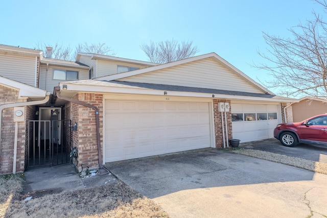 garage featuring driveway