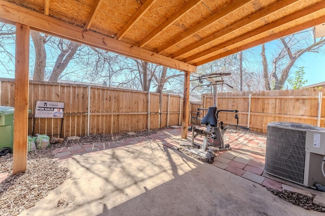 view of patio featuring central AC unit and a fenced backyard