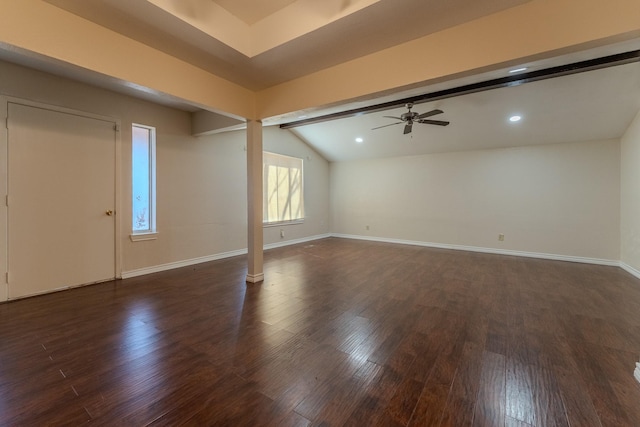 interior space featuring vaulted ceiling with beams, baseboards, and wood finished floors