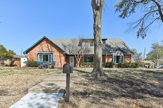 view of front of house featuring brick siding