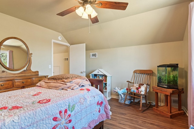 bedroom featuring lofted ceiling, wood finished floors, a ceiling fan, visible vents, and baseboards