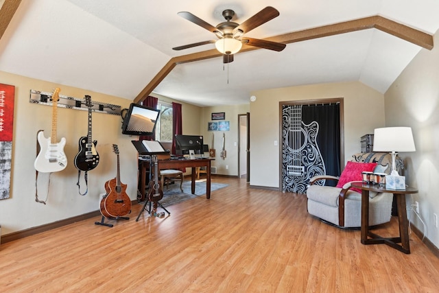 sitting room featuring vaulted ceiling, ceiling fan, light wood-type flooring, and baseboards