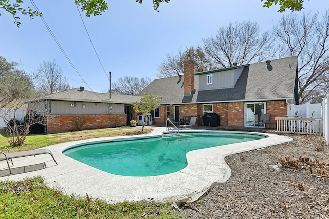 view of pool with a grill, fence, a fenced in pool, and a patio