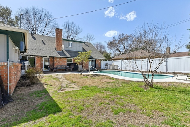 exterior space featuring a patio area, a fenced backyard, and a fenced in pool