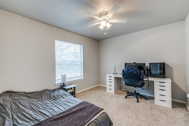 carpeted bedroom with ceiling fan and baseboards