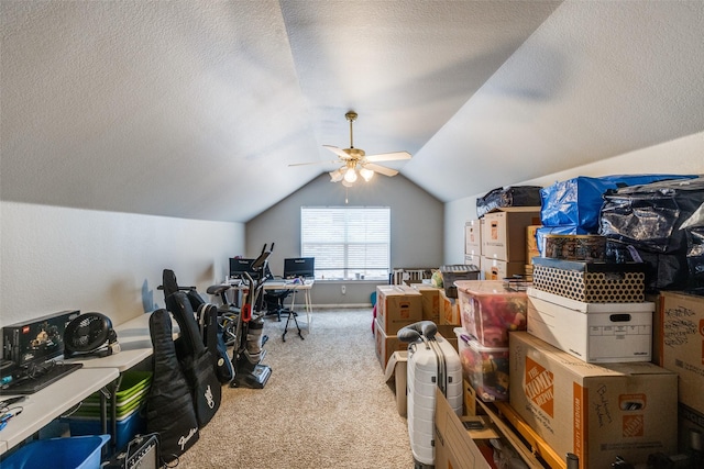 office with vaulted ceiling, carpet floors, a textured ceiling, and a ceiling fan