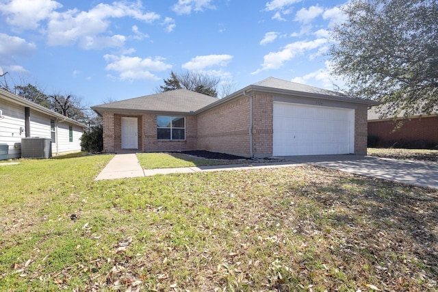 single story home with an attached garage, cooling unit, brick siding, driveway, and a front yard