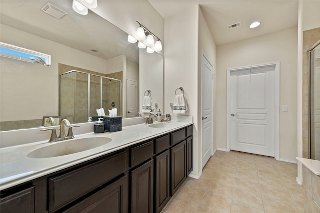 full bath with a stall shower, visible vents, and a sink