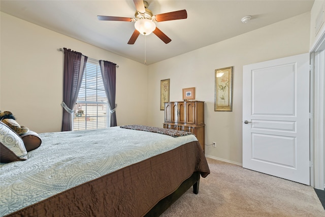 bedroom with baseboards, light colored carpet, and ceiling fan