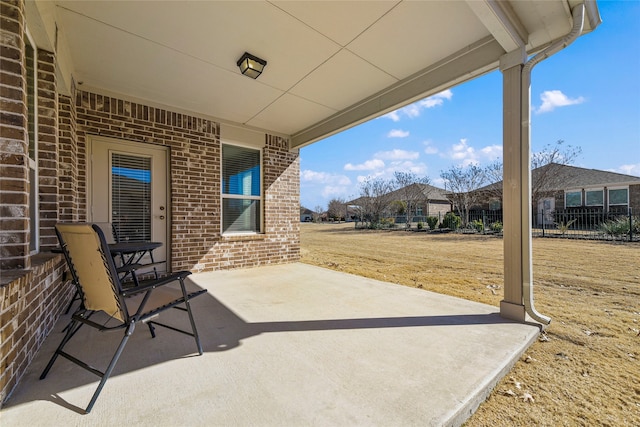 view of patio featuring fence