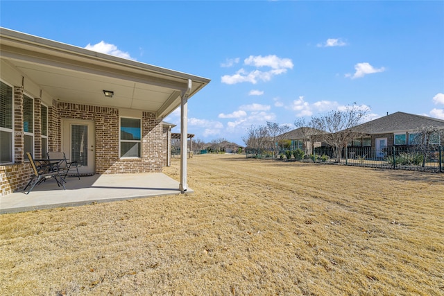 view of yard featuring a patio area and fence