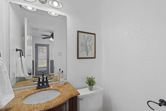 bathroom with toilet and vanity