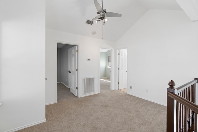 unfurnished bedroom with carpet floors, high vaulted ceiling, and visible vents