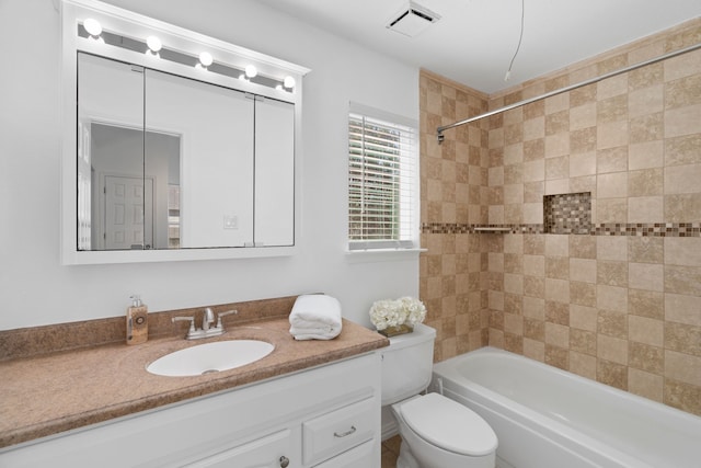 full bathroom featuring visible vents, vanity, toilet, and tub / shower combination