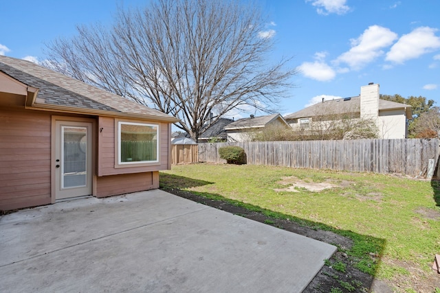 view of yard with a patio and a fenced backyard