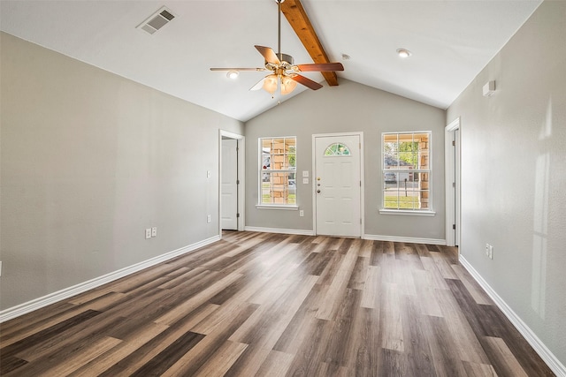 spare room with beam ceiling, dark wood finished floors, visible vents, and baseboards