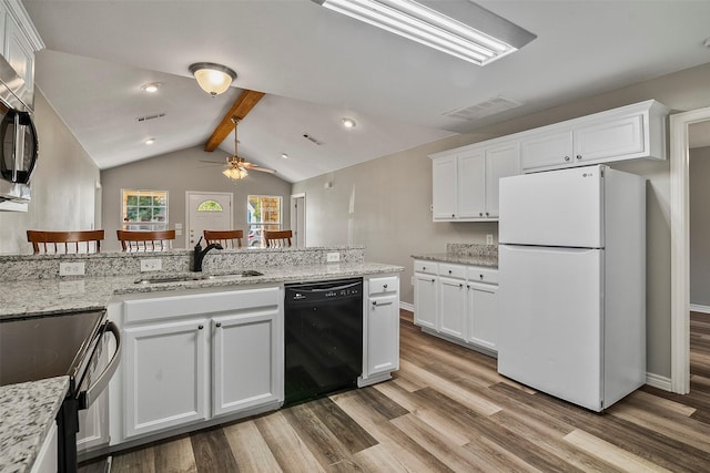 kitchen featuring visible vents, wood finished floors, vaulted ceiling with beams, black appliances, and a sink