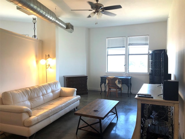 living area featuring a ceiling fan